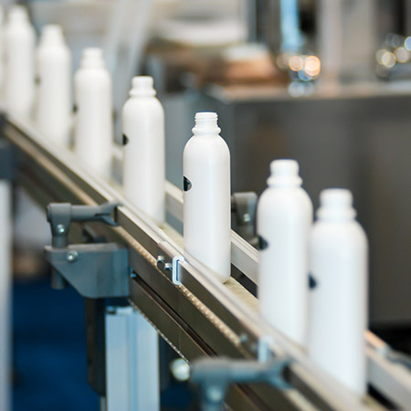 Bottles moving through a production line